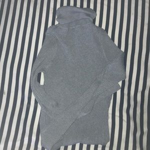 A gray turtle neck
